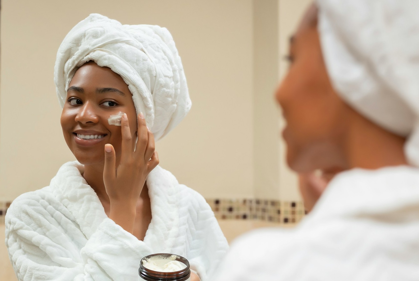 woman applying amazon skincare product