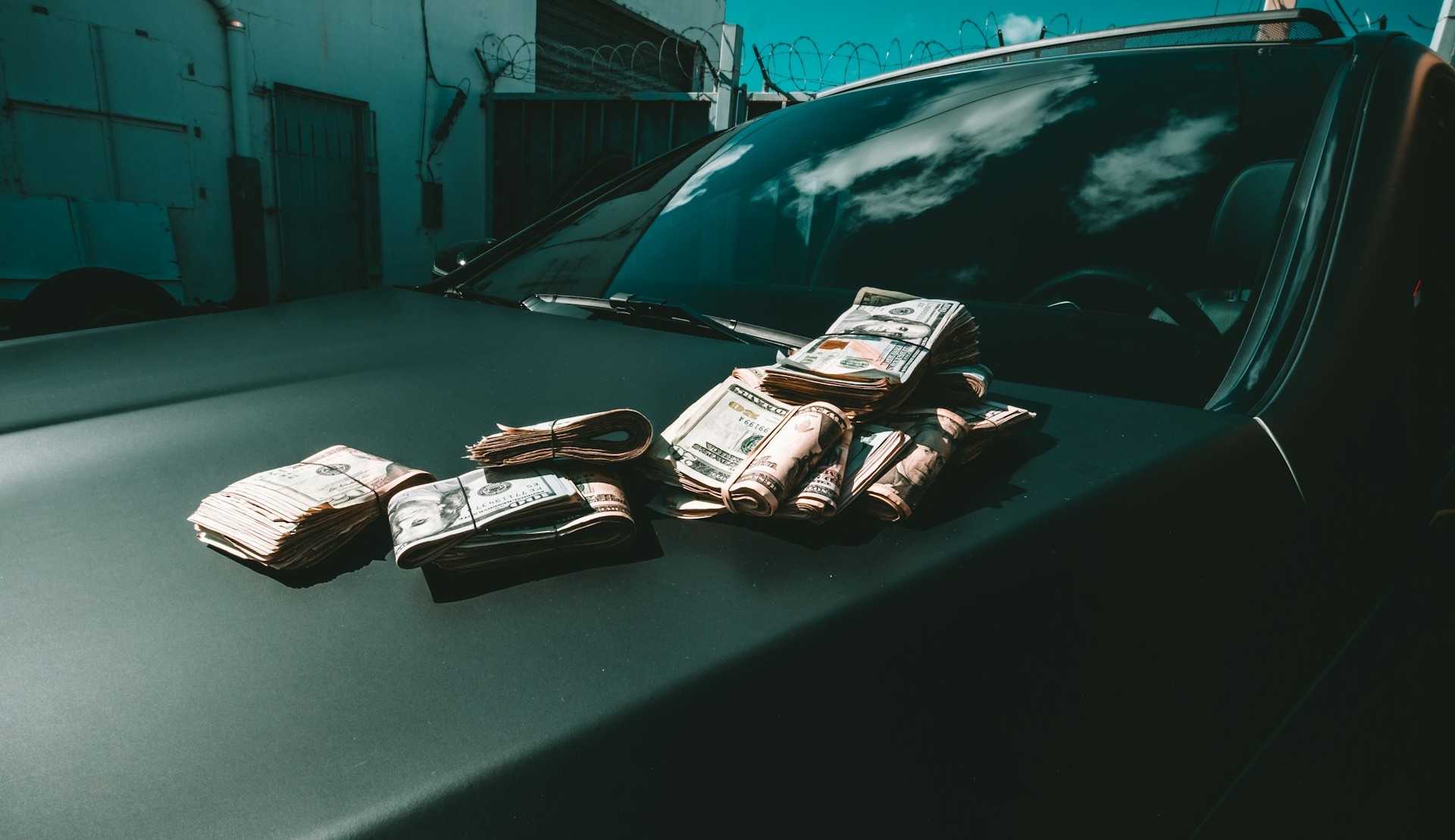 money on car hood: depiction of gve london scandal