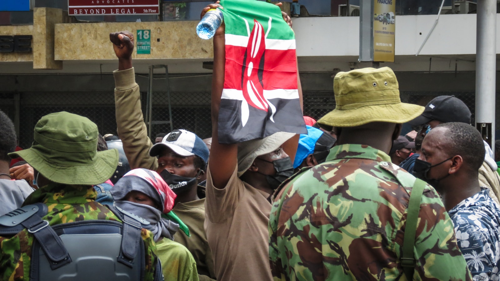 Protestors are holding a kenyan flag.